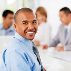 Intern Poses for Photo During Meeting